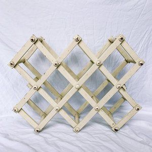 distressed white collapsible wooden wine rack